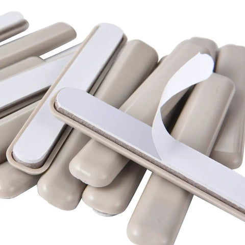 Close-up of 16 Piece Self Stick Furniture Sliders For Carpet Floors, beige HDPE pads showcasing tough adhesive backing.