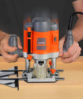 Man using Workhorse Plunge Wood Router With Edge Guide 110 120V 1.6 HP Motor Variable Speed 16000 30000 RPM for precision cutting.