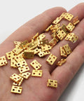 Hand holding Mini Copper Box Hinges 8x10mm Pack Of 30 For Wooden Jewelry Boxes And Small DIY Projects Flat Tiny Hinges For Crafts