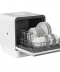 Portable Countertop Dishwasher With No Hookup Needed Making Plug And Play Setup Effortless For Tight Kitchens While Dual Spray Arms Spotlessly Clean Dishes Fast Using Quick Sanitize Modes Daily, showing open door with dishes.