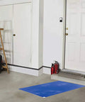 Sticky Mats For Clean Rooms Blue 24 By 36 Inches Walk Off Tacky Mats For Construction Home Lab Pet Garage Warehouse Floors 4 Pads With 30 Sheets Each Includes in a garage setting, placed near a door to capture dust from shoes.
