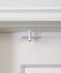 Straight Up Secure Metal Child Safety Door Lock top mount latch installed on a white door frame for home security.