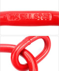 Close-up of red G80 steel chain sling ring with '7/8 MIL-8TCE' marking, used for lifting rigging in industrial applications.