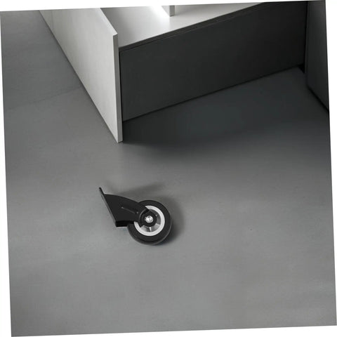 Four Piece Heavy Duty Sliding Door Roller Wheels And Rock Solid Side Mount Casters For Barn Doors Cabinets And Furniture featuring a black roller wheel on a gray floor.