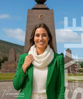 Woman wearing Ultra Cozy Winter Cashmere Infinity Scarf in Beige, standing outdoors in front of historic monument.