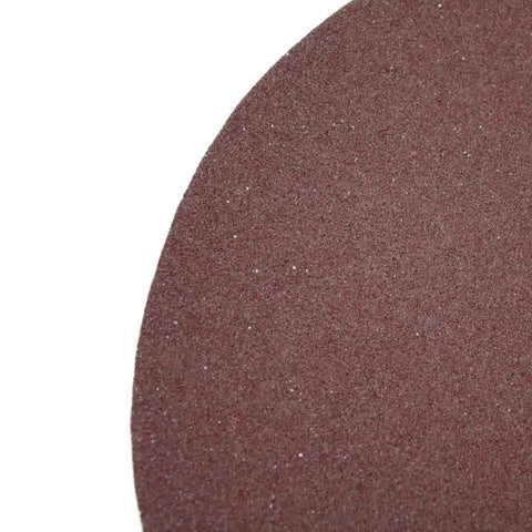 Close-up of 220 grit aluminum oxide sanding disc from 5 pack with loop backed design for clean clog resistant sanding on wood metal plastic