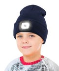 Child wearing Hands Free LED Beanie With USB Rechargeable Headlamp For Kids Unisex Winter Knit Cap Lighted Hat Navy Blue