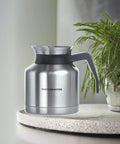 Thermal 1L Coffee Carafe With Brew Through Lid Keeps Coffee Hot While Brewing Stainless Steel Carafe on textured surface