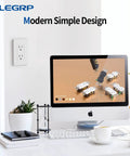Matte White Decorator Wall Outlet 15A 125V NEMA 5-15R installed in office setting with computer and plants