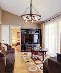 Farmhouse Wagon Wheel Chandelier 25 Inch Diameter Rustic Metal Finish With Six Lights in living room setting