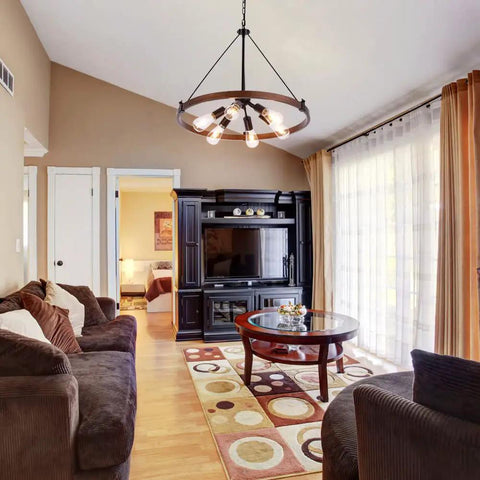 Farmhouse Wagon Wheel Chandelier 25 Inch Diameter Rustic Metal Finish With Six Lights in living room setting