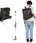 Person with handheld manual fertilizer spreader with bag for farm crops like corn vegetables sugar cane and fruit trees
