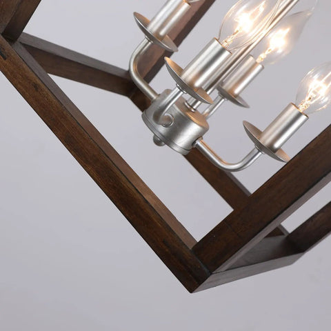 Close-up of Oak Wood Farmhouse Lantern Pendant Light With Silver Metal Finish featuring geometric frame and exposed bulbs.
