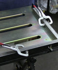 Worksite Ready Welding Table Pro Grade With 1.1 Inch Slot Top Adjustable Height And Tilt Casters For Easy Mobility Retractable Guide Rails Eccentric Leveling Feet Three Position Angled Tabletop For Horizontal 30 Degree Or Folded Storage Use, close-up view of slot top with clamps