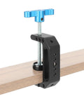 Aluminum C Clamp With 1/4 Inch And 3/8 Inch Mounting Points Blue T Handle Beefy Heavy Duty Desk Cart Bench Post Clamp Jaw Opens 3mm To 65mm Rock Solid Rigging For Studio Cameras Woodworking And DIY Projects clamped to a wooden board