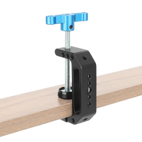 Aluminum C Clamp With 1/4 Inch And 3/8 Inch Mounting Points Blue T Handle Beefy Heavy Duty Desk Cart Bench Post Clamp Jaw Opens 3mm To 65mm Rock Solid Rigging For Studio Cameras Woodworking And DIY Projects clamped to a wooden board