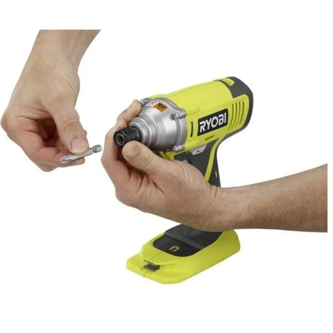 Person holding Eighteen Volt Cordless Hammer Drill And Impact Driver Combo Kit with focus on bit attachment.