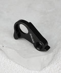 Black Rear Derailleur Hanger EP0716-02 on stone surface, aluminum alloy, replacement for Canyon 40 Endurace Inflite Aeroad Grail series