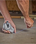 100 Foot Aluminum Chalk Reel With Sliding Chalk Refilling Door, Pro Grade Durability From A Cast Aluminum Body, in use on jobsite