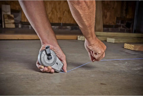 100 Foot Aluminum Chalk Reel With Sliding Chalk Refilling Door, Pro Grade Durability From A Cast Aluminum Body, in use on jobsite