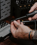 Pro Spec 43 Piece Gunsmithing Screwdriver Set With Grip Tight Handles and Built Tough S2 Steel bits being used in hand.