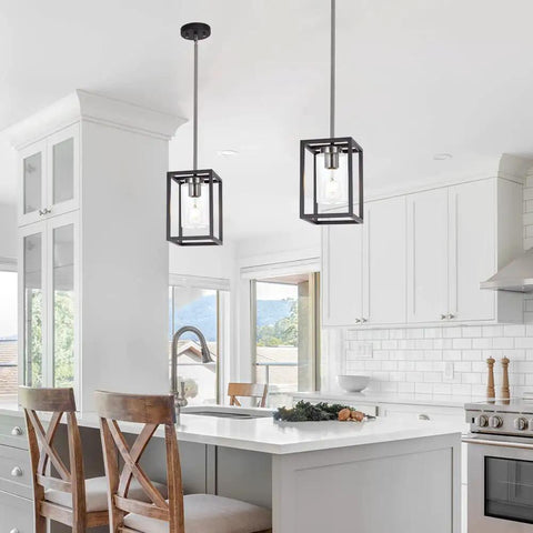 Single Black And Brushed Nickel Pendant Light With Clear Glass Shade Sleek Modern Industrial Chandelier in white kitchen