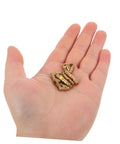 Hand holding Brass Concealed Cylinder Hinges Set 25 Pcs Mini Barrel Cabinet Hinges for Jewelry Boxes Keepsake and Craft Boxes.