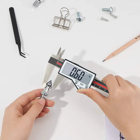 8 Inch Digital Caliper With Waterproof Stainless Steel Body measuring a small metal part with large LCD screen