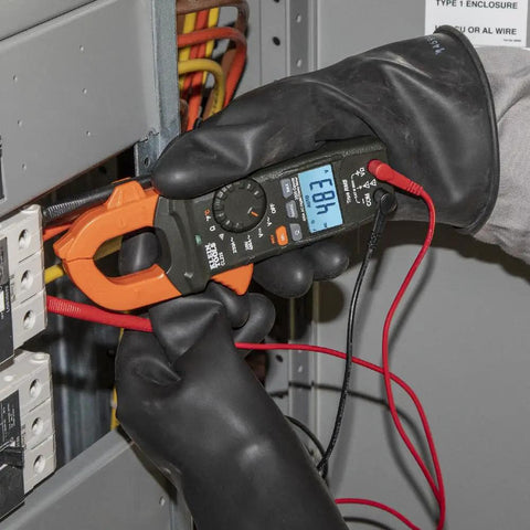 Digital Clamp Meter Workhorse With 400A Auto-Ranging Clamp, AC/DC Voltage, TRMS, in use during electrical panel testing