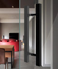 Push Pull Door Handle for Glass, Wood, and Barn Doors Black Lacquered Stainless Steel installed on glass door in modern room