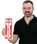 Reflective Fire Extinguisher Sign Sticker With Down Arrow Pack Of 3 4 By 12 Inches Vertical Sign for Biz and Home Engineer Grade Decals, front view held by person