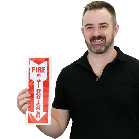 Reflective Fire Extinguisher Sign Sticker With Down Arrow Pack Of 3 4 By 12 Inches Vertical Sign for Biz and Home Engineer Grade Decals, front view held by person