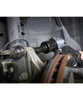 Mechanic using 231C Half Inch Drive Air Impact Wrench with Beefy 600 Ft Lbs Torque, 8000 RPM in auto repair shop
