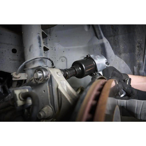 Mechanic using 231C Half Inch Drive Air Impact Wrench with Beefy 600 Ft Lbs Torque, 8000 RPM in auto repair shop