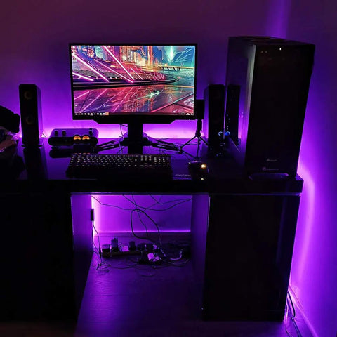 20Ft LED Black Light Strip Kit With 360 LEDs 12V Flexible Ultraviolet Light illuminating a desk setup in dark room