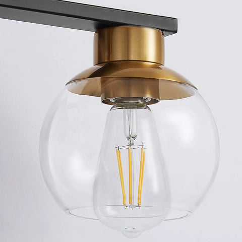 Close-up of globe glass shade on Black Gold 5 Light Vanity Light Fixture With Globe Glass Shades Over Mirror Wall Sconce E26 Base
