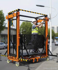 Heavy Duty Electric Scaffolding Lift Platform 1100 Lb Capacity 16.4 Ft Vertical Rise with worker adjusting it on a job site.