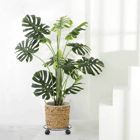 Heavy Duty 12 Pack Threaded Swivel Caster Wheels With Hella Smooth Rolling And Locks Up Tight Brakes Built Real Tough For Moving Large Potted Plants On Plant Stands In Black, showcasing a plant in a woven basket on casters.
