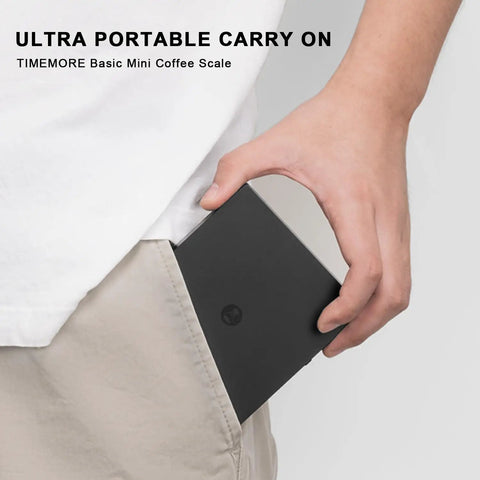 Person slipping Ultra Slim Mini Coffee Scale With Timer For Espresso And Baking into pocket, highlighting portability