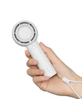 Hand holding Bladeless Mini Portable Fan With Safe Design Turbo Handheld Breeze 5 Speed Modes USB Rechargeable Up To 16 Hours Cool Time