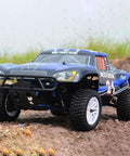 1 To 10 Scale Nitro RC Truck 4WD Off Road Beast For Adults Two Speed Remote Control Car With Methanol Fuel Power Igniter Short Course Buggy Rugged Climber For High Adrenaline Fun, shown on rocky terrain.
