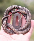 Koshirae Tsuba Fuchi Kashira Menuki Set for Samurai Swords with detailed snake design in alloy, shown in hand for size reference.