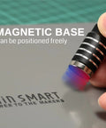 Close-up of finger positioning a magnetic arm on Magnetic Helping Hands Soldering Station With Large 11.1x7.1 Inch Base.