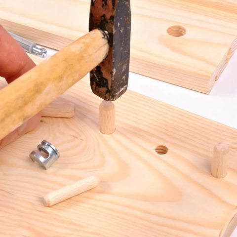 Using hammer to insert dowel from 100 Pcs Wooden Dowels Set With 50 M6 And 50 M8 Fluted Dowels For Crafts Furniture DIY Woodworking