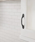 Matte Black Ravino Cabinet Pull 3 Inch Center-To-Center 5 Inch Overall Length Transitional Drawer Handle on kitchen cabinet door