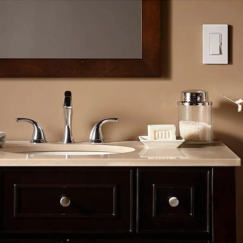Reliable Wall Dimmer Switch For Dimmable LED CFL And Halogen Bulbs With Frustration Free Hookup And Buttery Smooth Control For Single Pole Or Three Way Installations In Solid Midnight Trim on a bathroom wall.