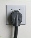 Two-Gang Flush Mount 2.15 Inch Device Receptacle Wall Plate installed on wall, aluminum steel, smooth finish, with plug inserted