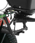 Close-up of 12V lawn tractor spreader's mounting bracket and hopper for grass seed and fertilizer, part of Tow Behind 12V Lawn Tractor Spreader For Grass Seed And Fertilizer With 80 Pound Capacity And Lightweight Frame Weighing Sixteen And A Half Pounds For Easy Lawn Care And Even Distribution Across Large Yards.