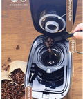 Fully Automatic Coffee Maker With Built In Bean Grinder And Smart Led Touch Display brewing fresh coffee with a detachable lid and beans.