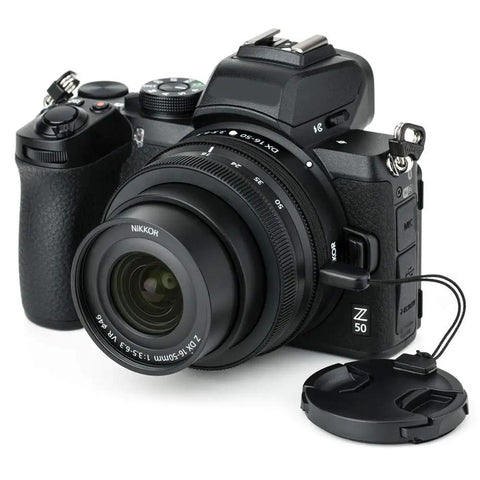 Nikon Z50 camera with Two Pack 46mm Front Lens Cap With Deluxe Cap Keeper, Center Pinch Design, shown with lens attached